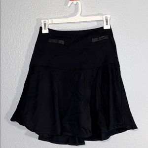 black skirt with faux-leather like fake pockets